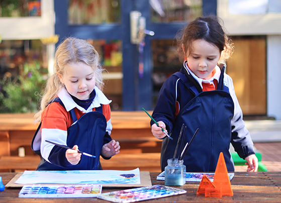 Kindergarten child painting at Fahan School