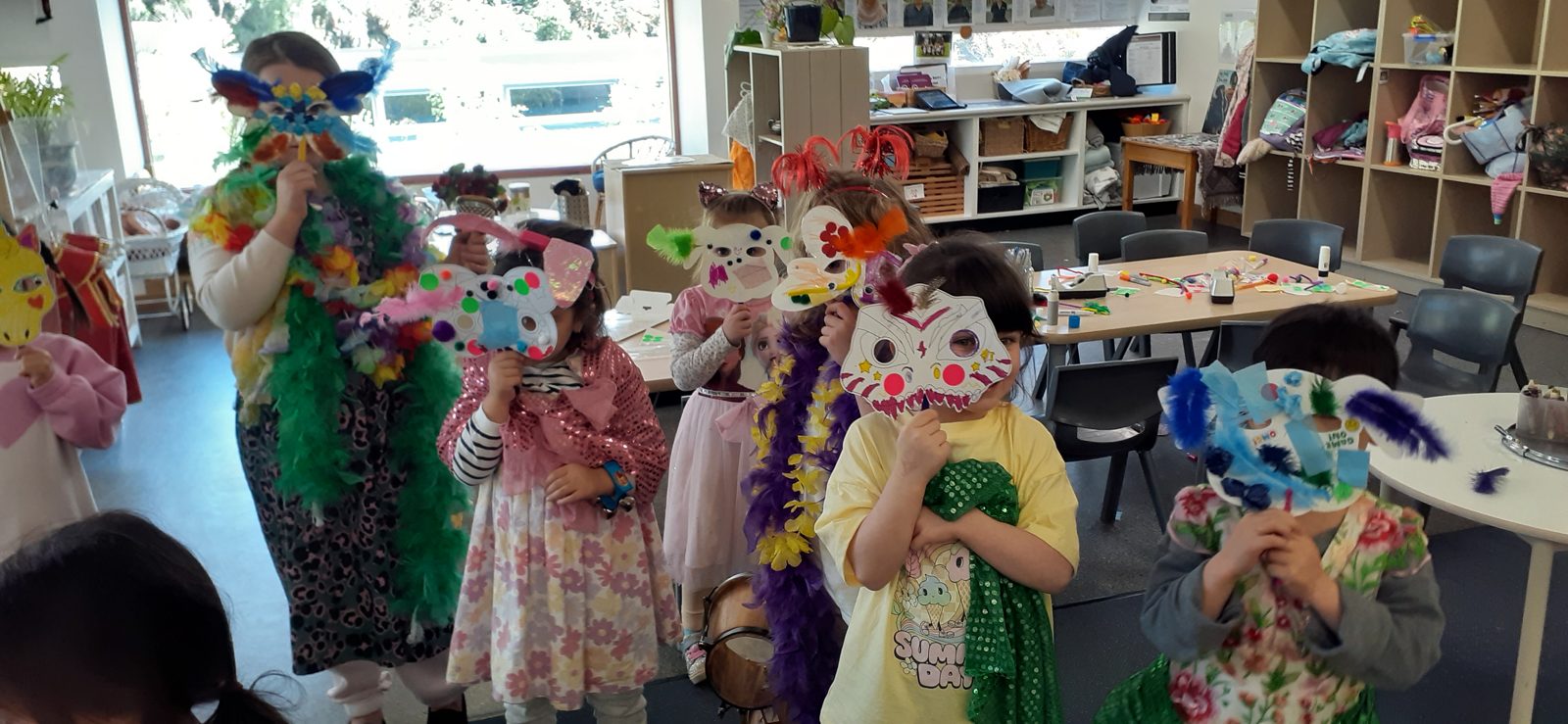Pre-Kinder children in dress-up and craft play