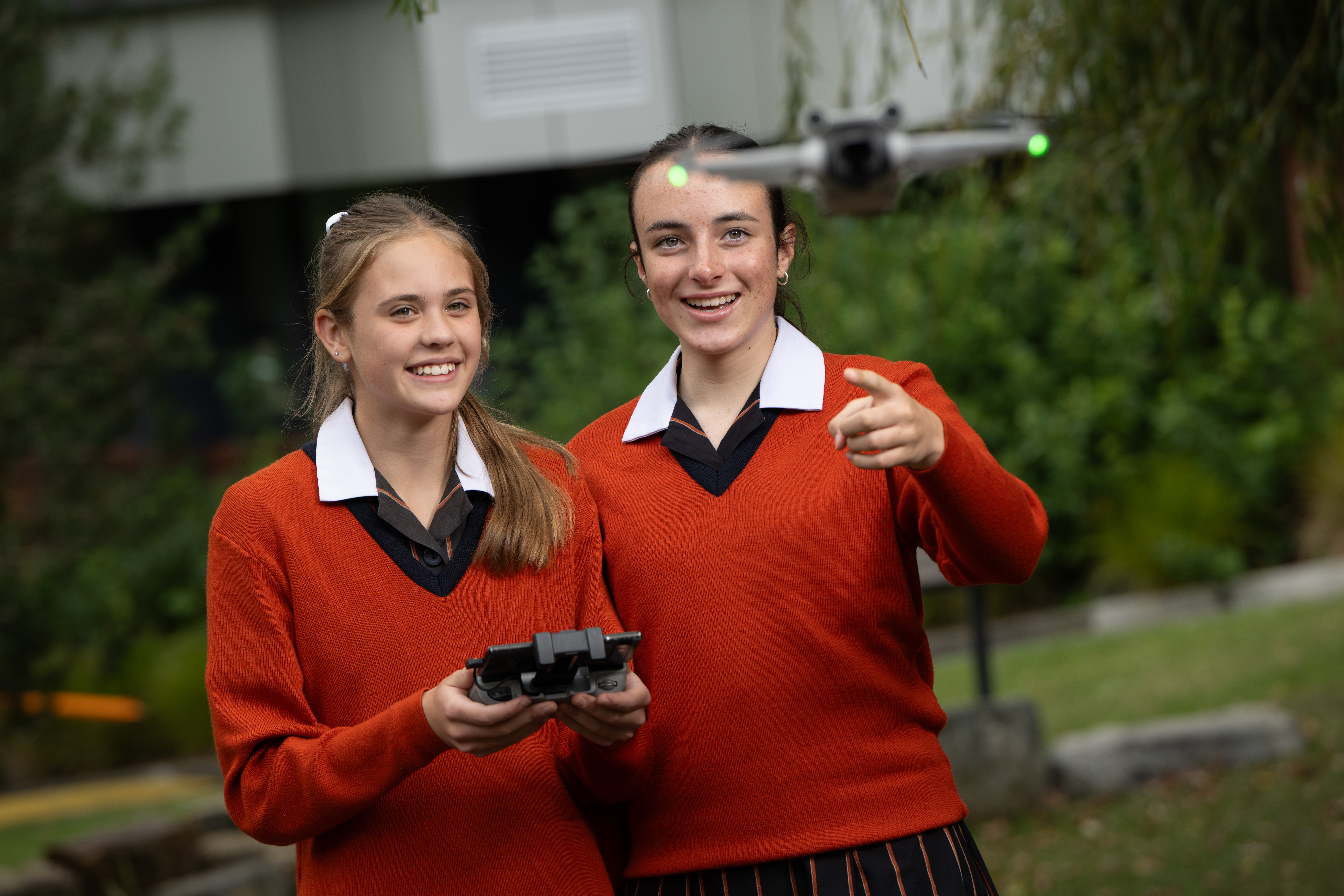 two students with a drone